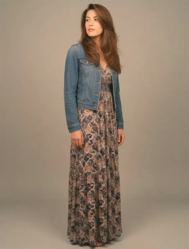denim jacket over a printed maxi dress by krea 2