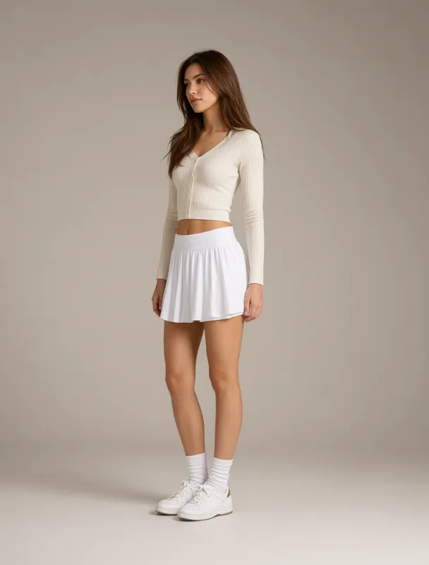 cropped cardigan with a pleated tennis skirt by qwen image 2.1