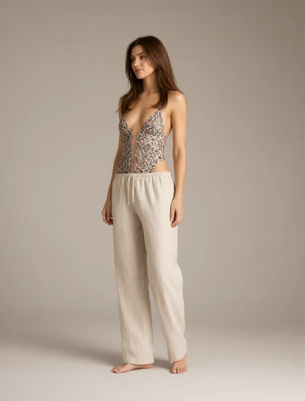 linen beach pants over a swimsuit by qwen image 2.1