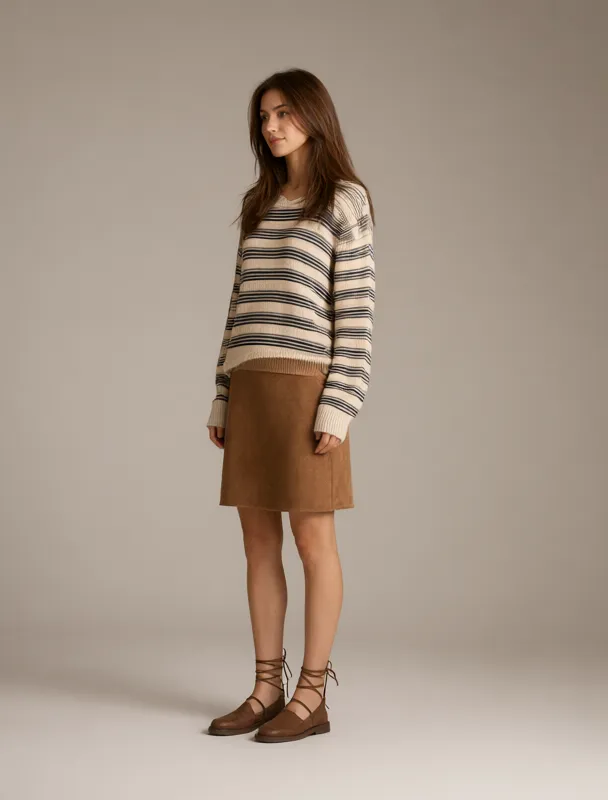 striped knit top with a suede skirt by qwen image 2.1